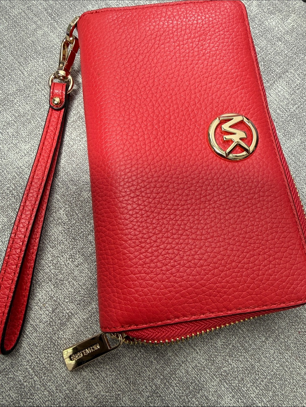 Michael Kors peach pebble leather wristlet/ wallet